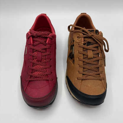 Two low top sneakers shown from above. One is red and the other is brown.