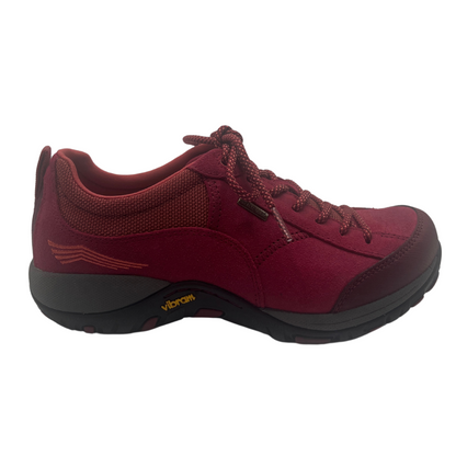 Right facing view of red hiking sneaker with thick vibram rubber outsole and matching laces
