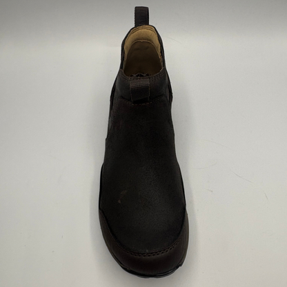 Top view of a short brown boot with two pull tabs and a contoured outsole