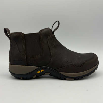 Right facing view of a short brown boot with two pull tabs and a contoured outsole
