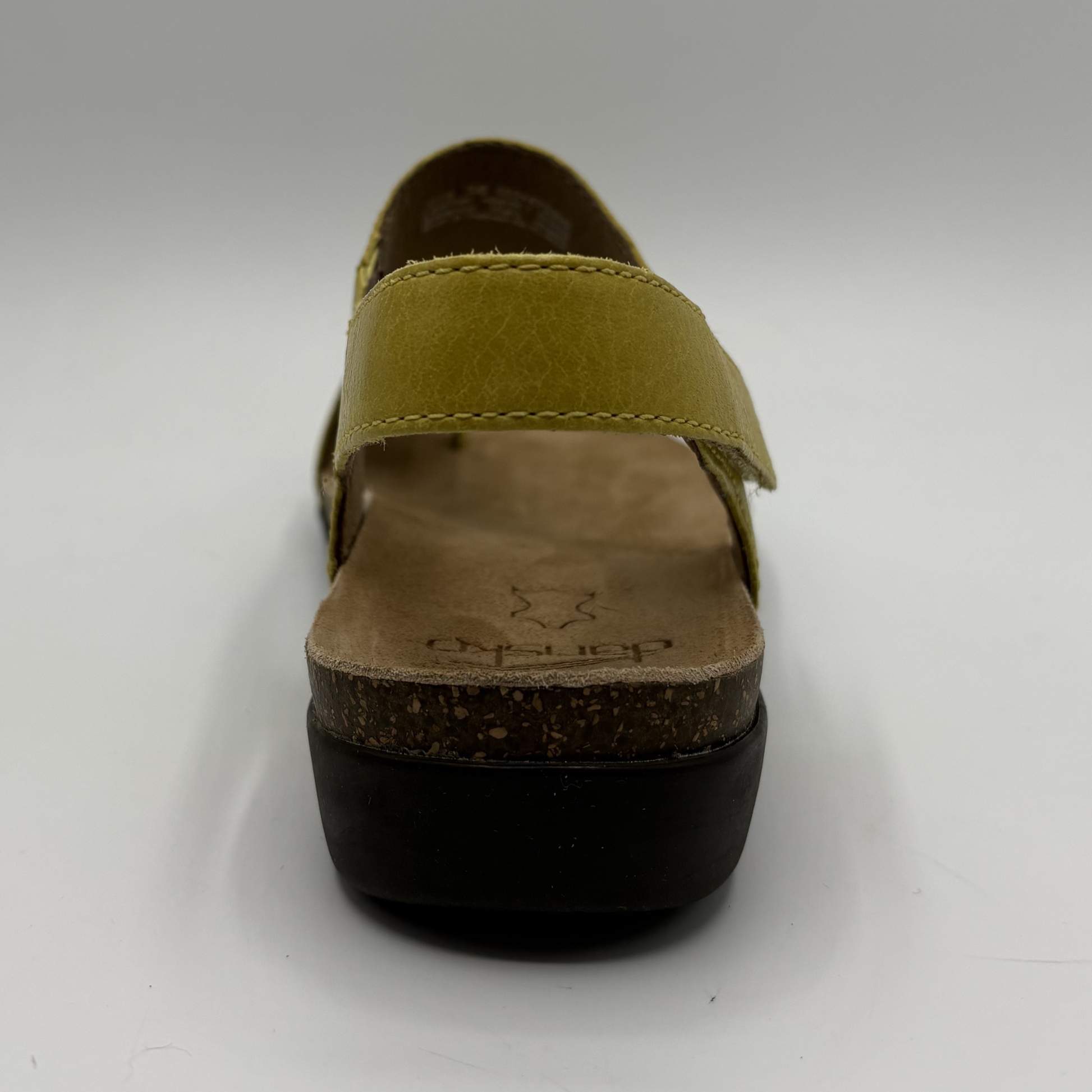 Yellow sandal with cork sole on a white background