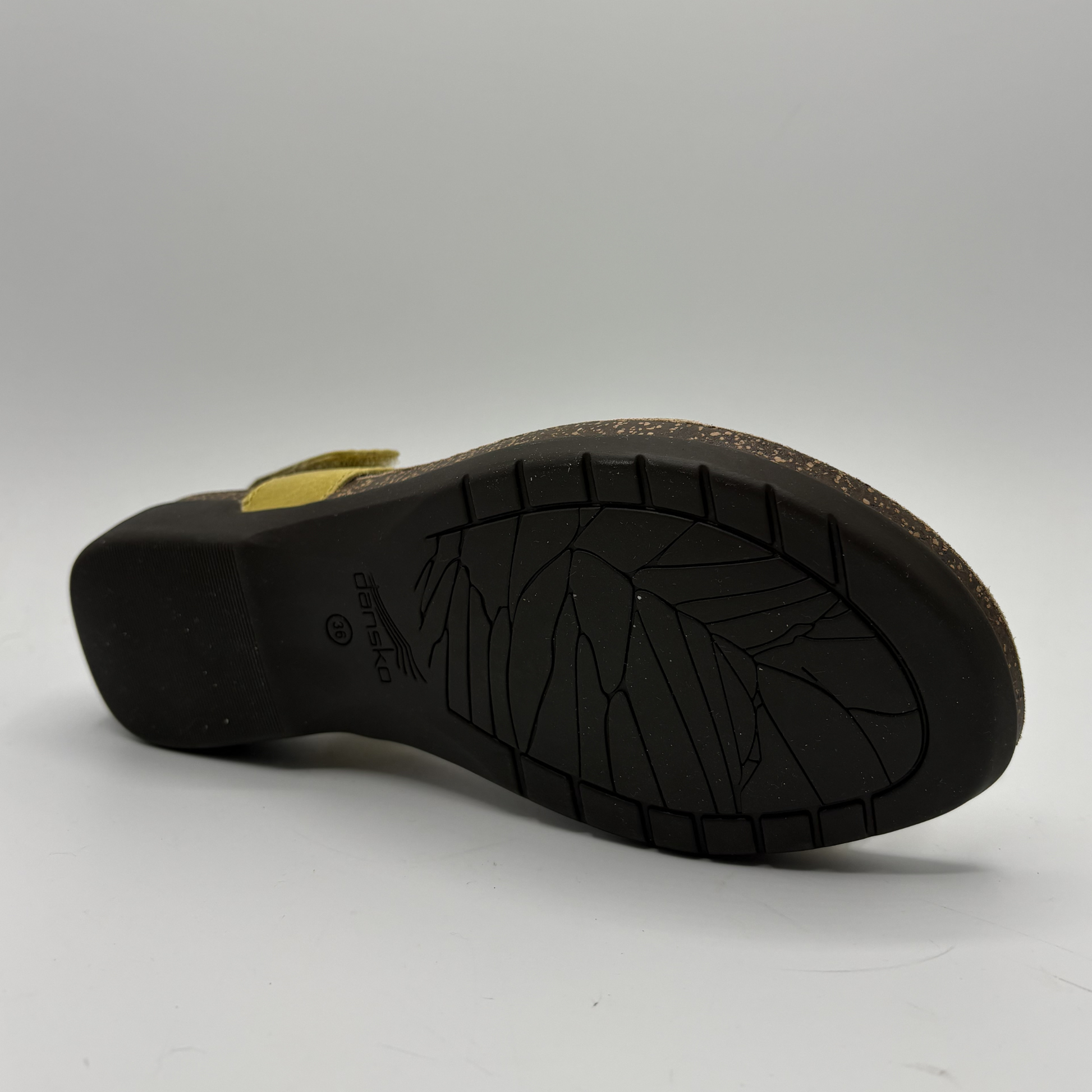 Black sandal sole with brand logo on a white background