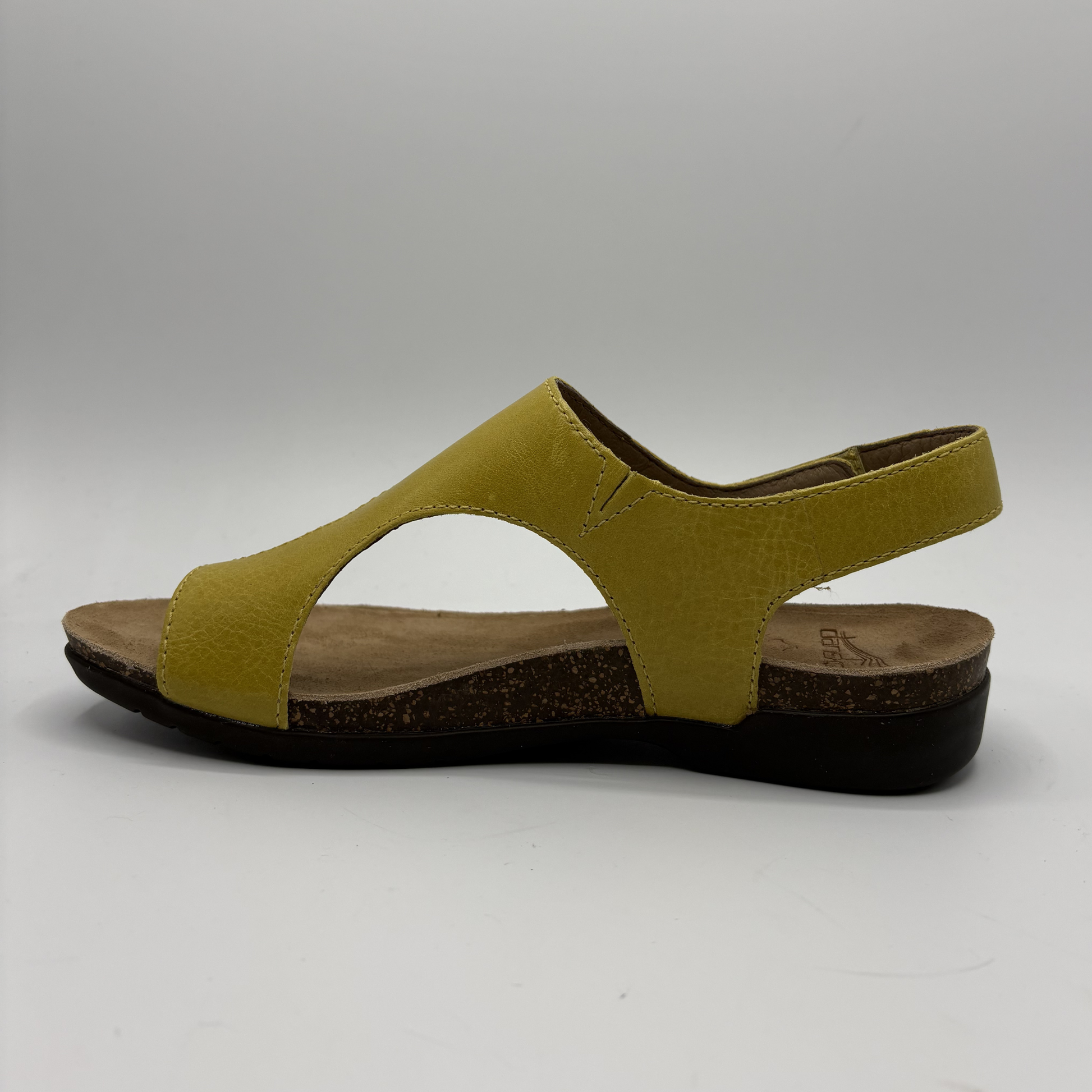 Yellow sandal on a gray background
