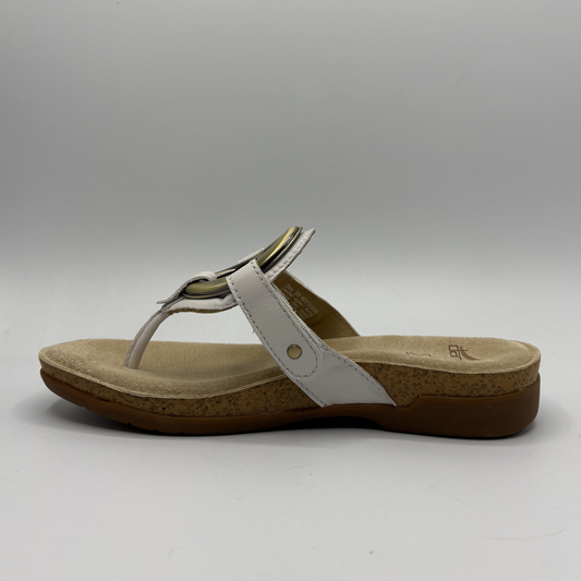 Beige sandal with a brown sole on a gray background