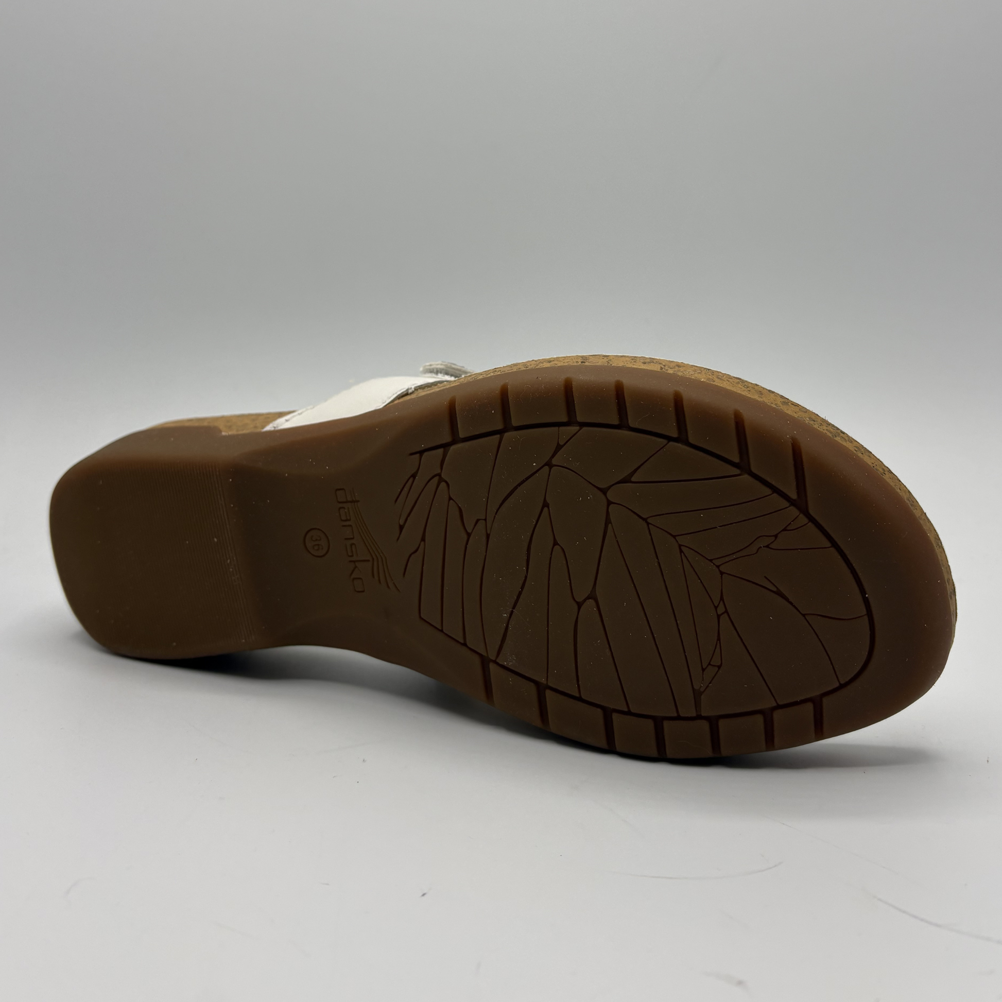 Brown sole of a shoe on a white background