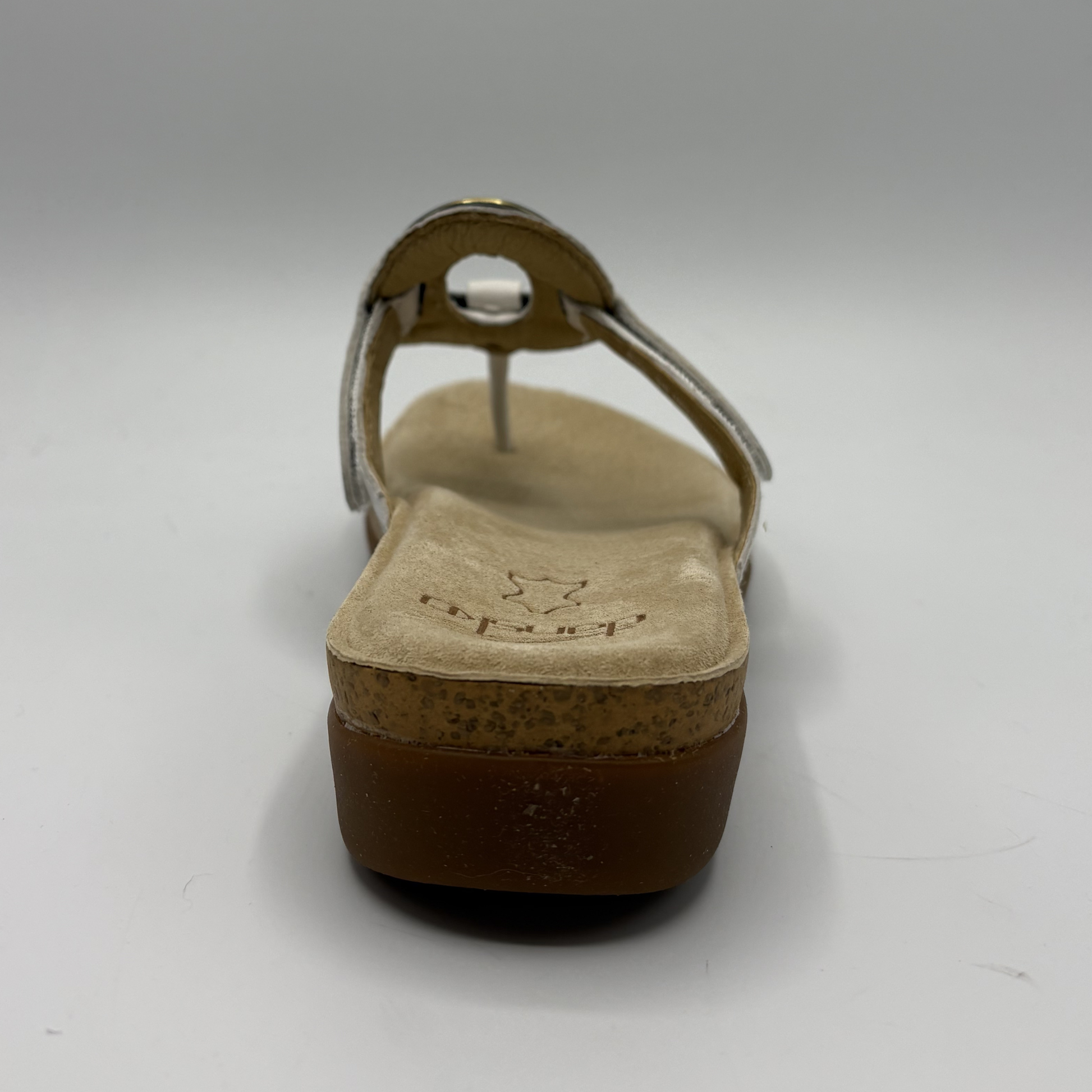 Brown sandal with cork sole on a white background