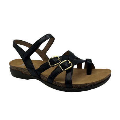 Angled view of black leather and nubuck sandal with gold buckles and a cork and rubber outsole