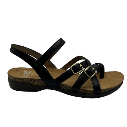 Right facing view of black leather and nubuck sandal with gold buckles and a cork and rubber outsole