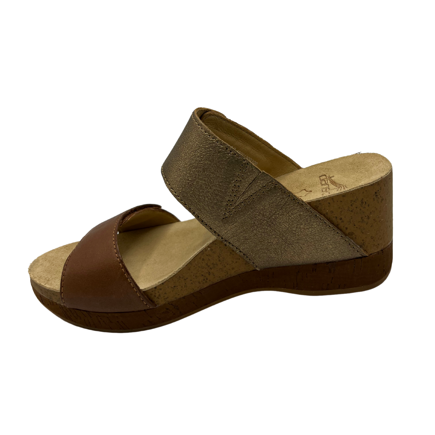 Left facing view of slip on wedge sandal with adjustable straps and suede lined footbed.