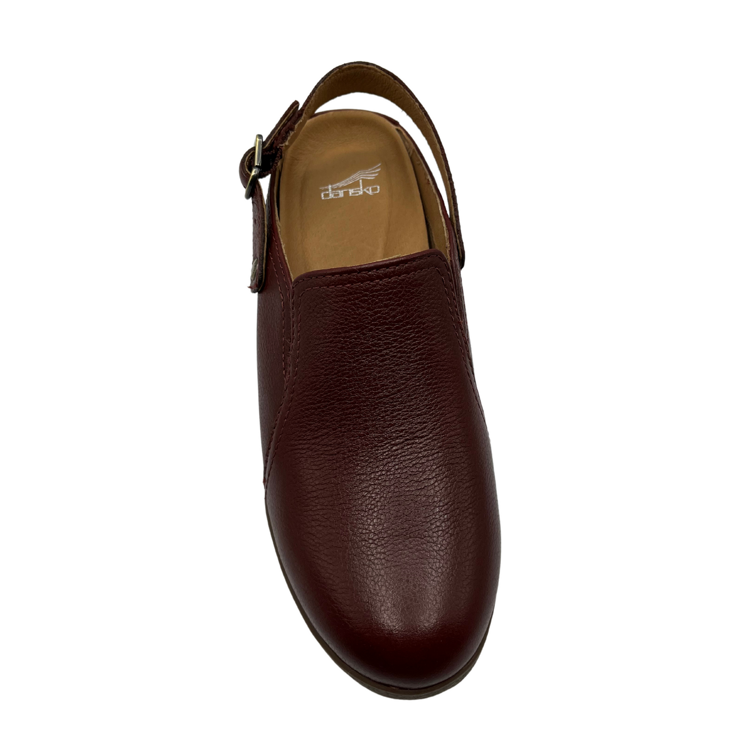 Top view of leather wedge slip on shoe with sling back strap and rounded toe.