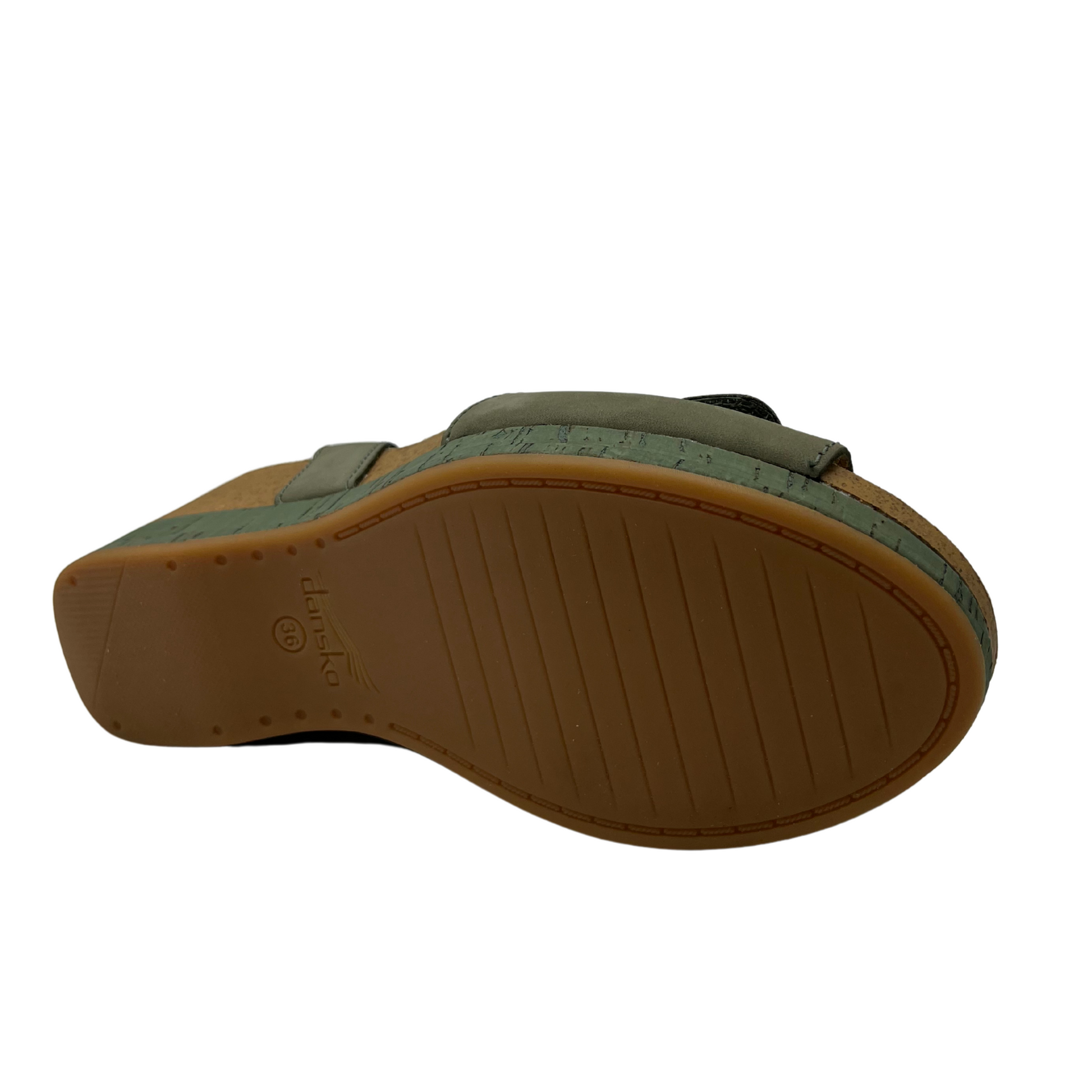 Bottom view of a nubuck and suede wedge sandal with adjustable velcro straps in a soft sage colour.