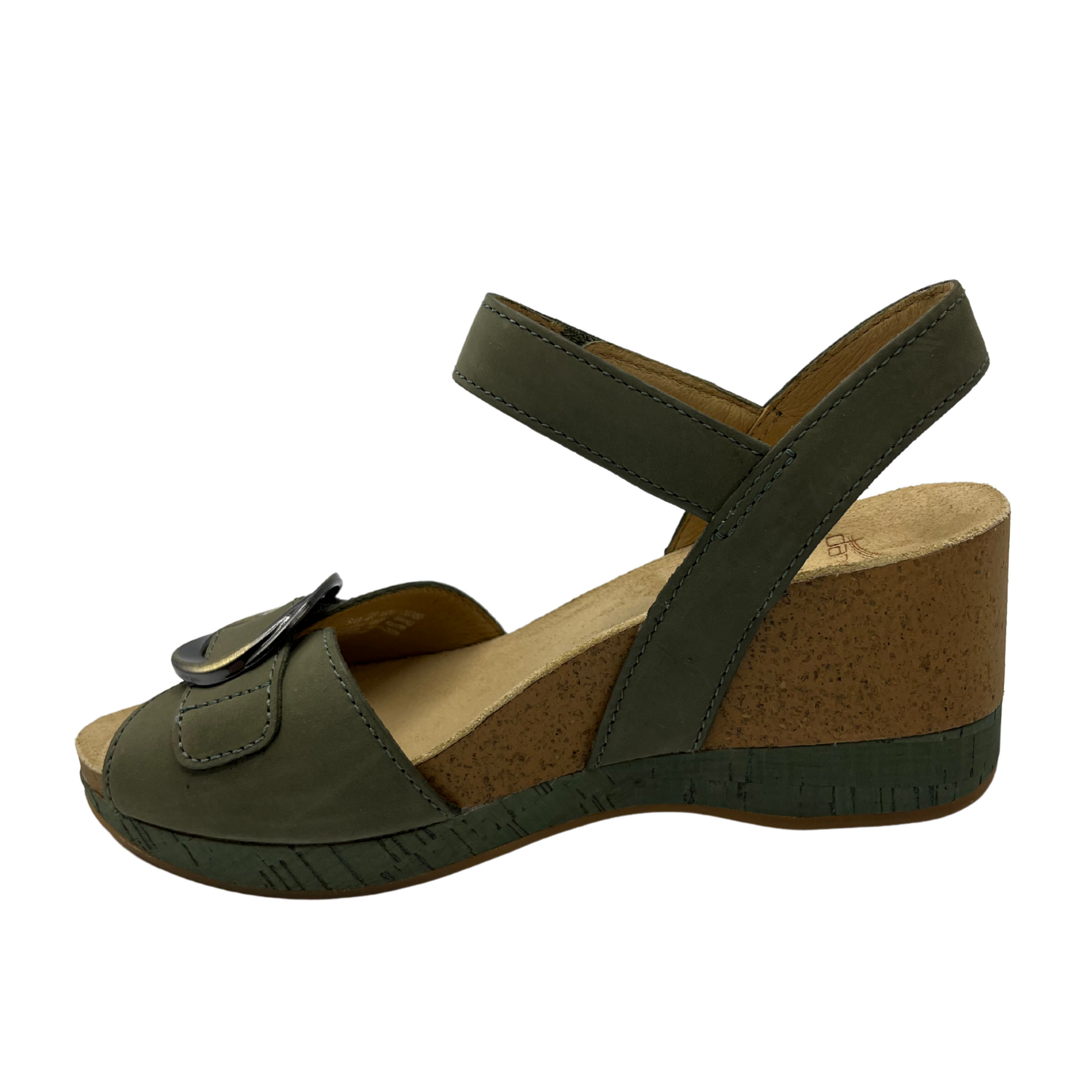 Left view of a nubuck and suede wedge sandal with adjustable velcro straps in a soft sage colour.