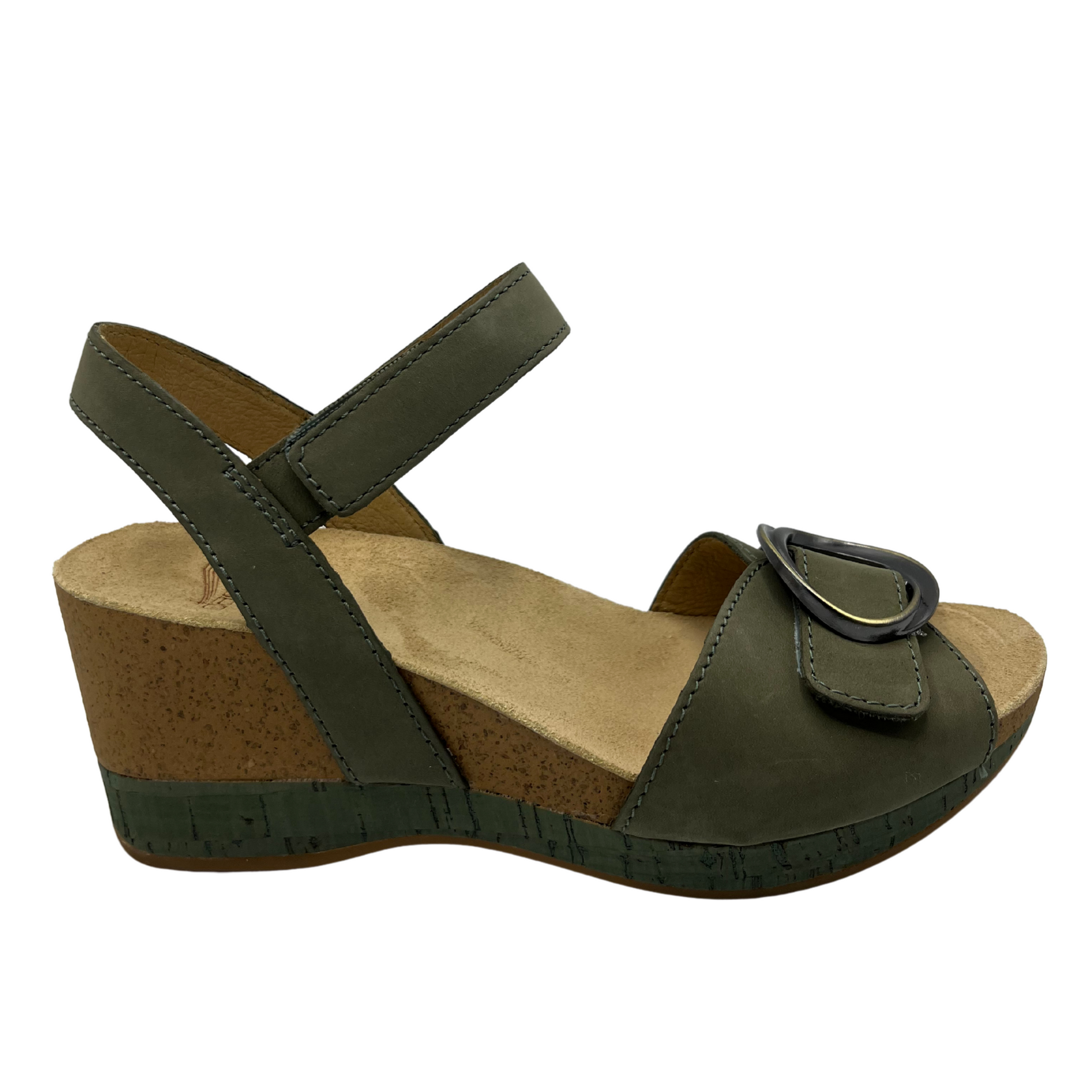 Right facing view of a nubuck and suede wedge sandal with adjustable velcro straps in a soft sage colour.