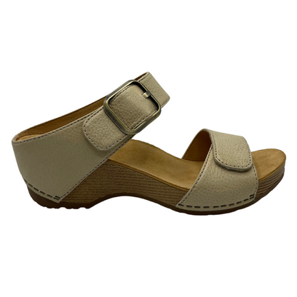 Right facing view of linen leather sandal with gold buckle strap and chunky heel