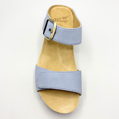 Light blue sandal with a beige sole on a light gray background