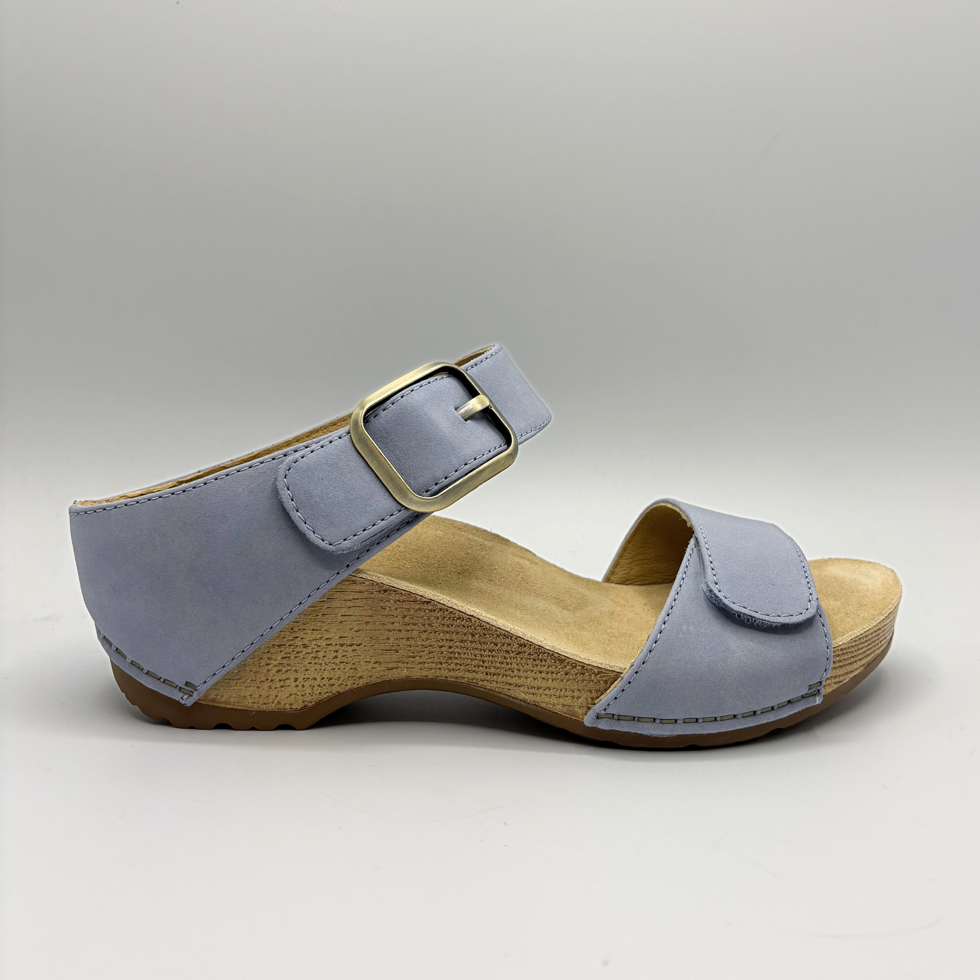 Blue sandal with wooden sole on a gray background