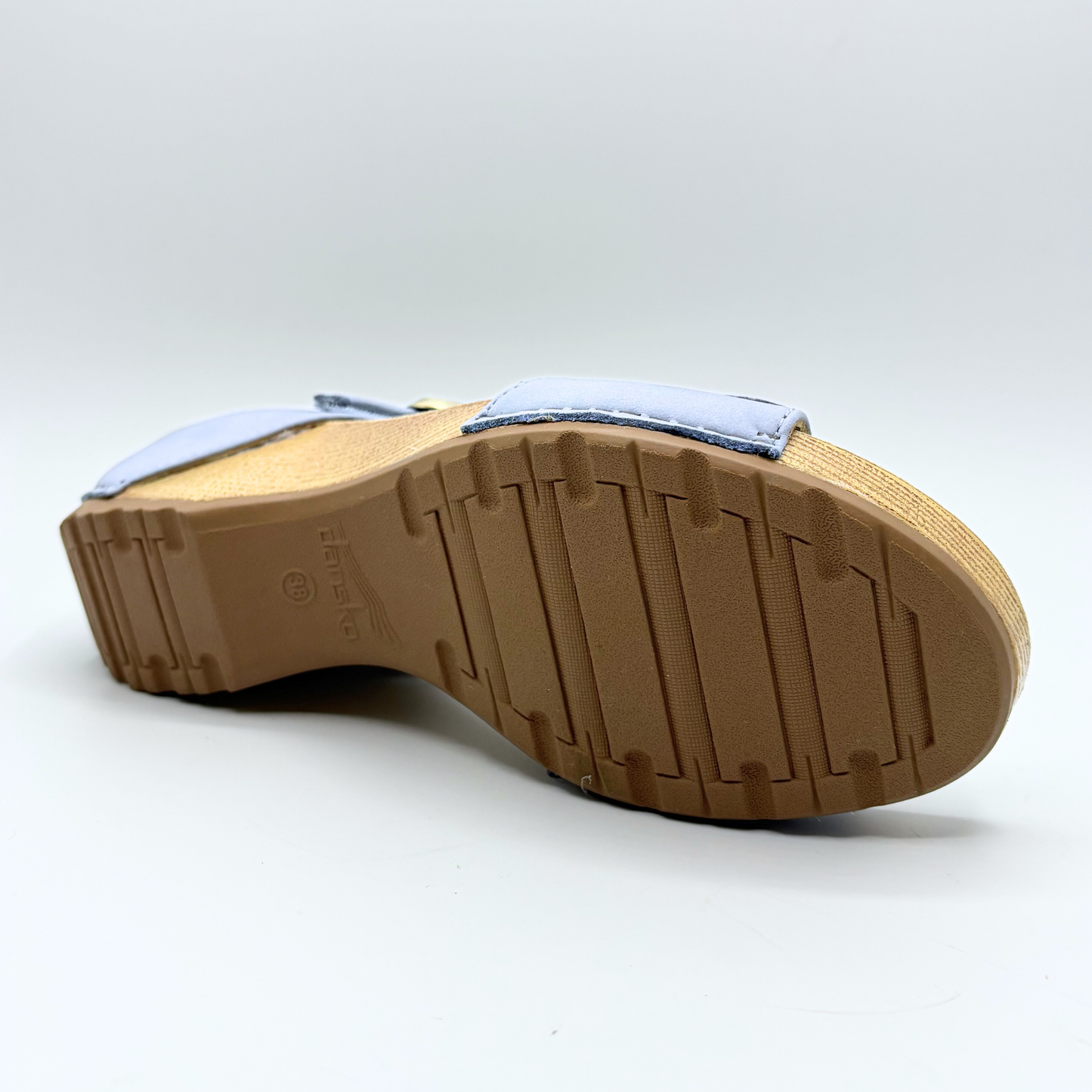 Brown sole of a shoe on a white background