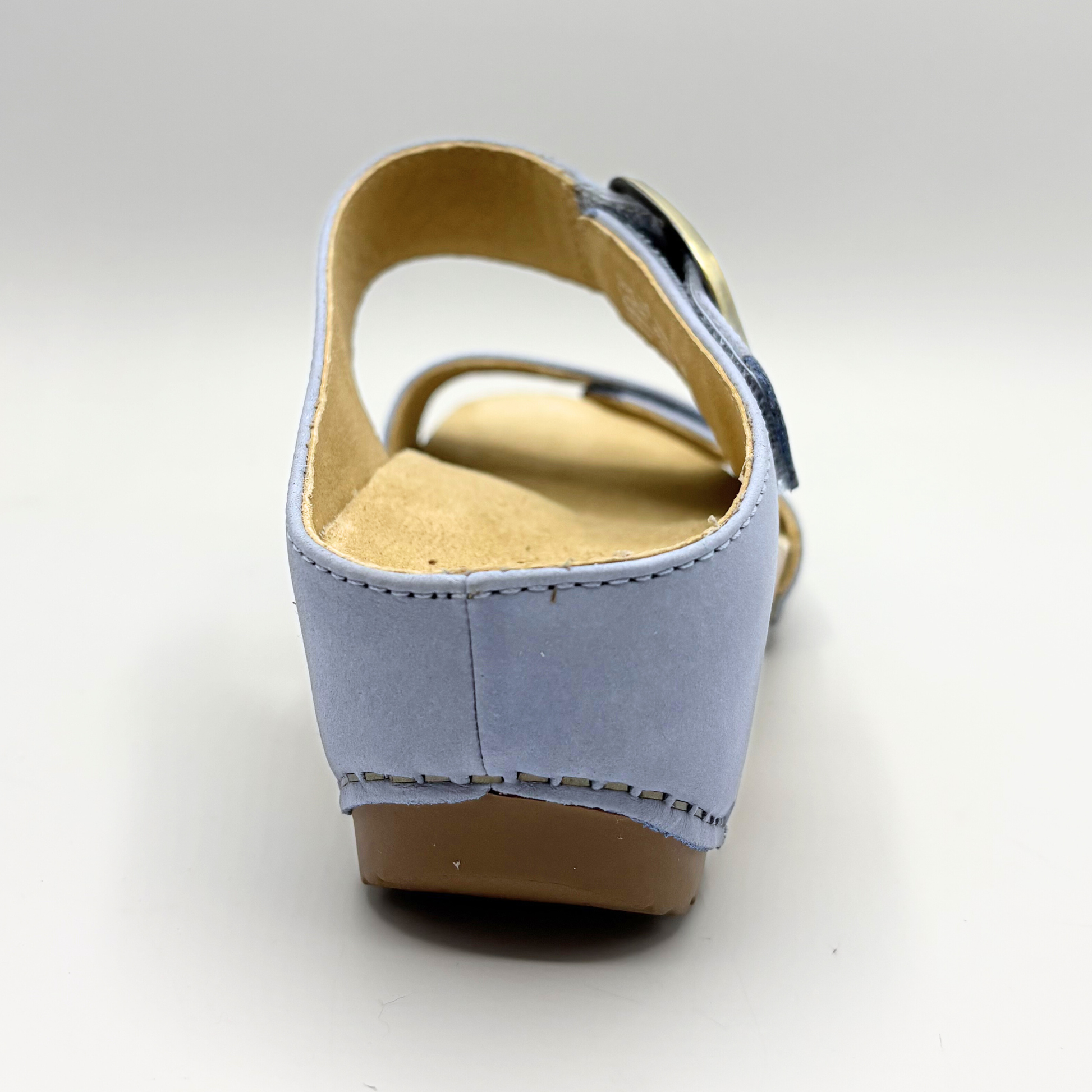 Light blue wedge sandal on a white background