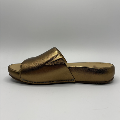 Gold sandal on a white background