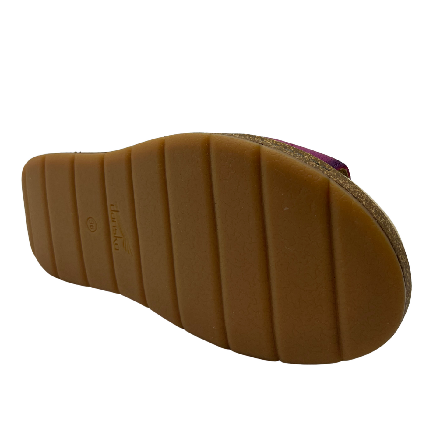 Bottom view of plum suede slip on sandal with thick crossed straps, thick cork outsole and suede wrapped footbed.