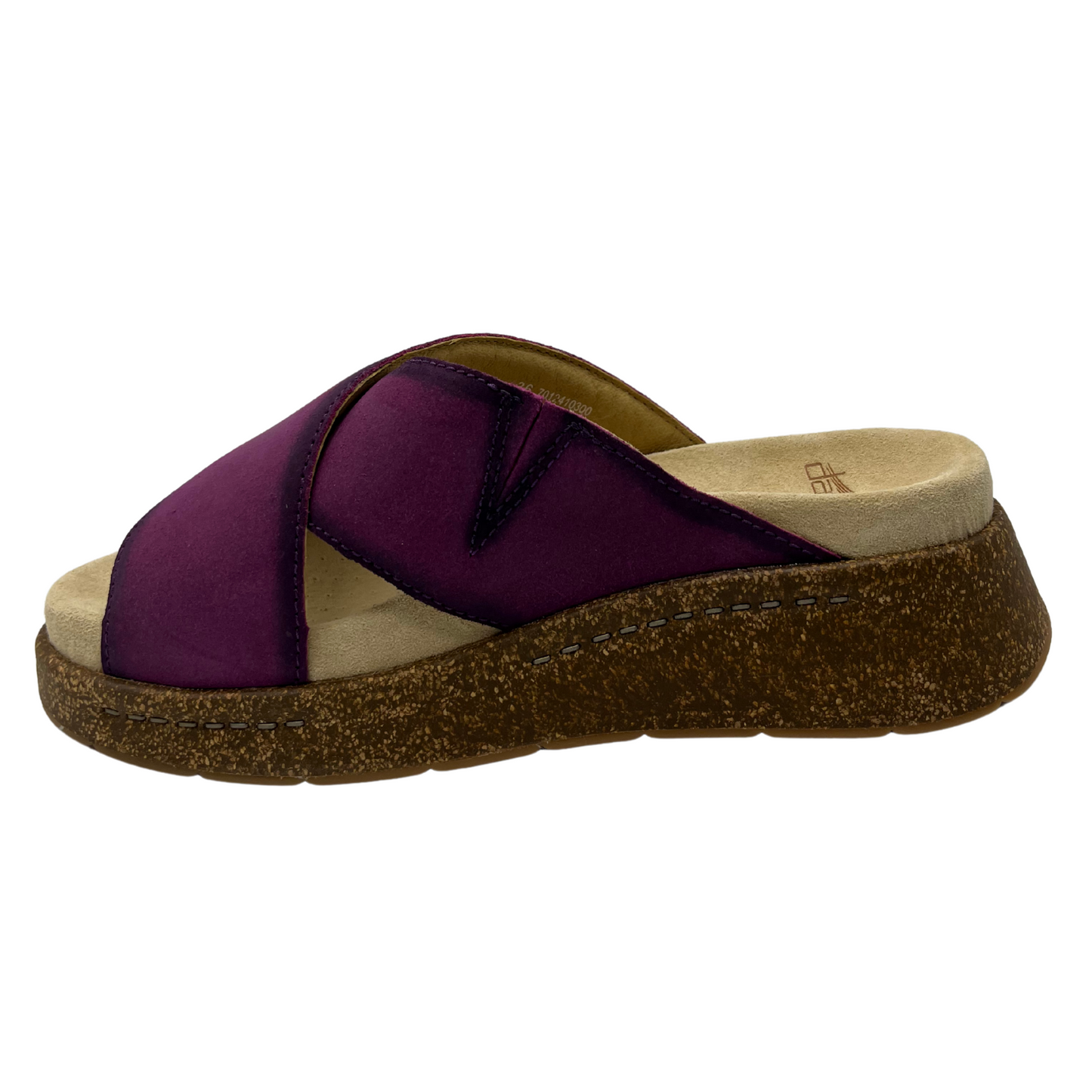 Left facing view of plum suede slip on sandal with thick crossed straps, thick cork outsole and suede wrapped footbed.