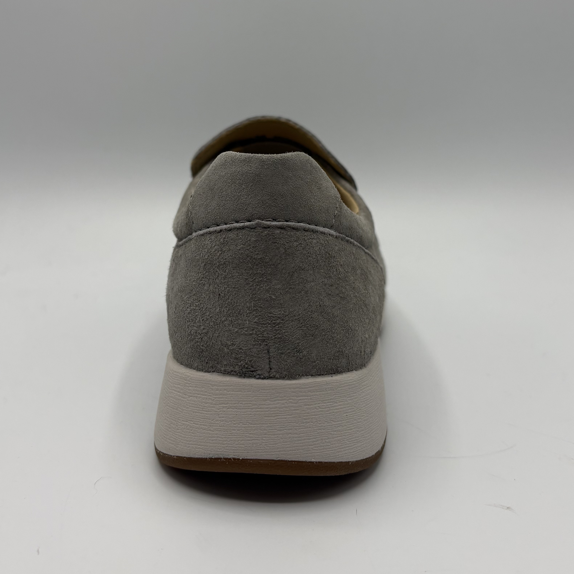 Gray suede loafer shoe on a white background