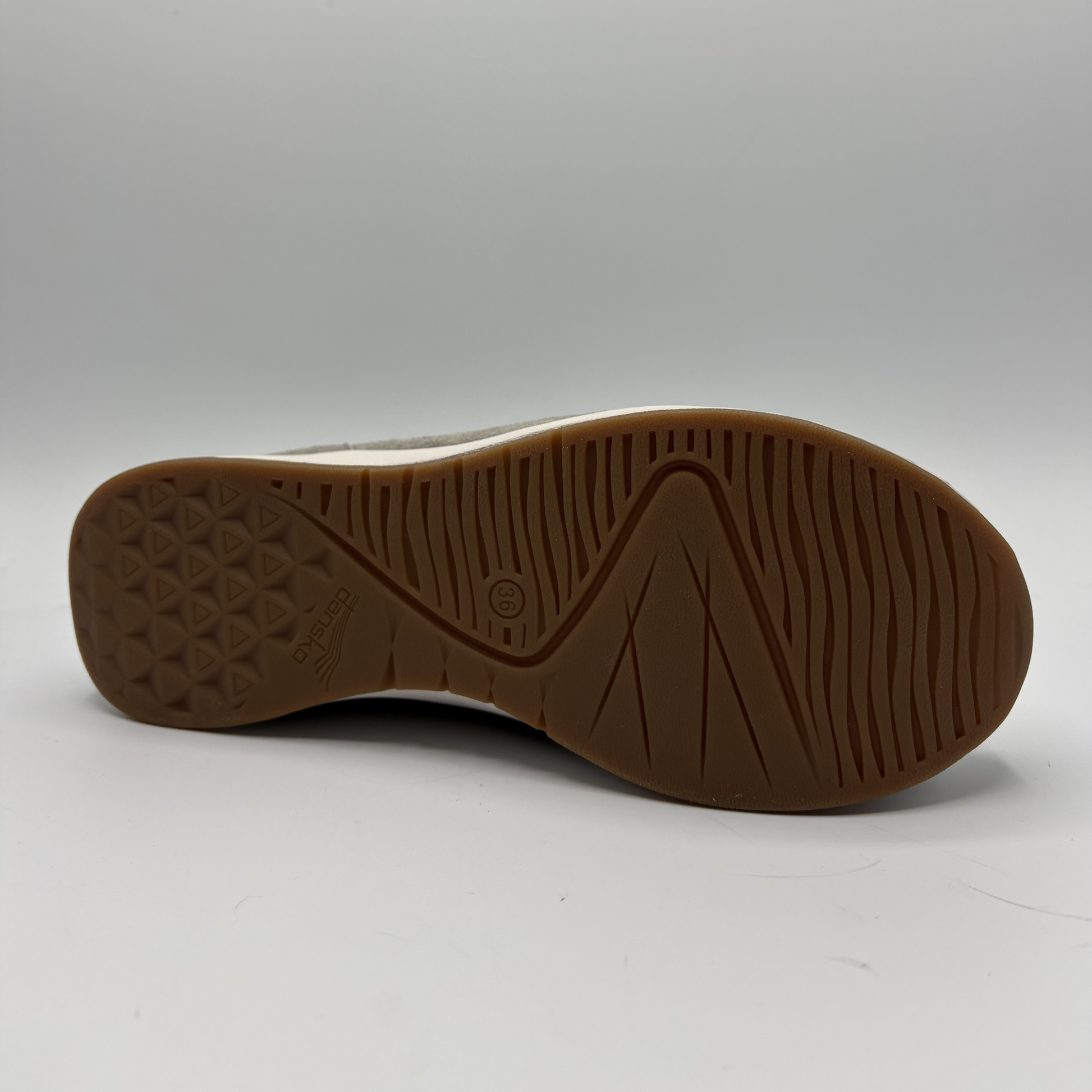 Brown sole of a shoe on a white background