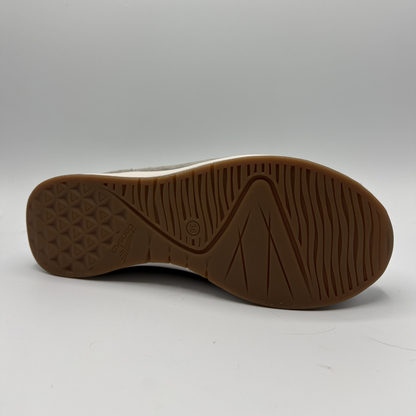 Brown sole of a shoe on a white background