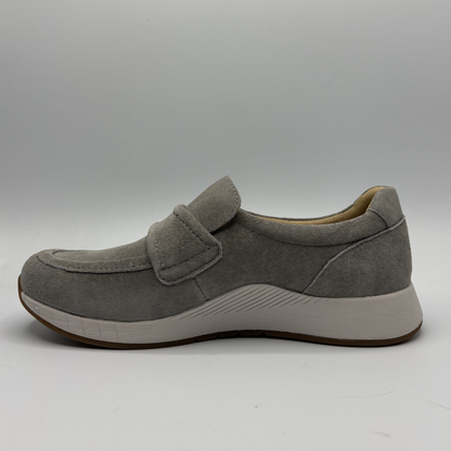 Gray shoe with a strap on a gray background