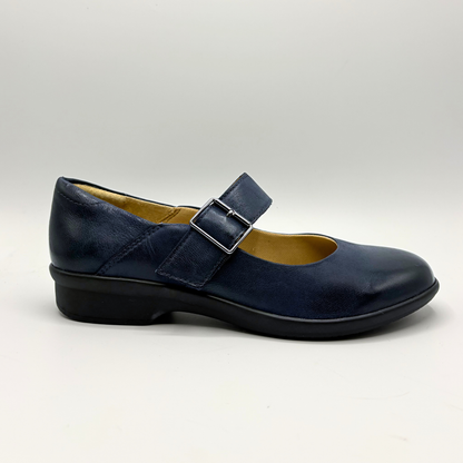 Navy blue shoe with a buckle on a light gray background