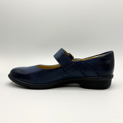 Navy blue shoe with a strap on a white background