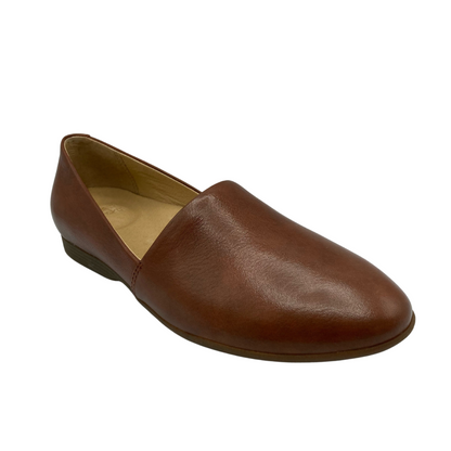 Angled view of brown leather loafer with tan coloured inside