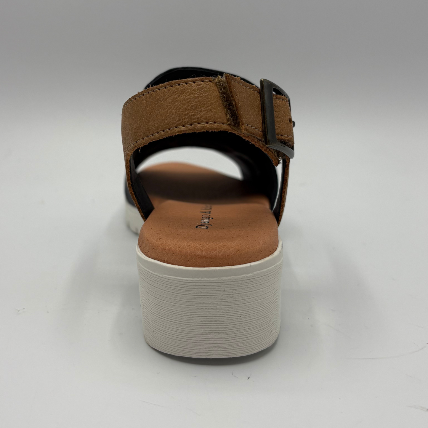 Brown sandal with a platform sole on a white background