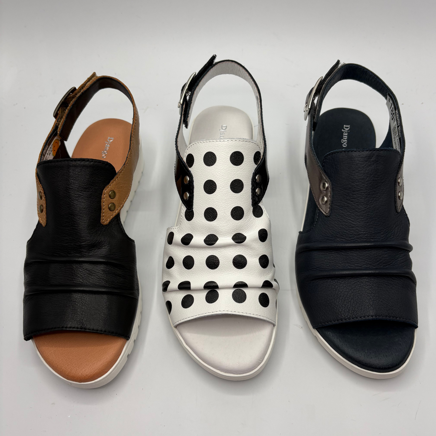 Three pairs of sandals on a light gray background