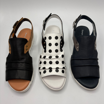 Three pairs of sandals on a light gray background