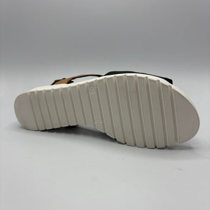 White sole of a sandal on a gray background