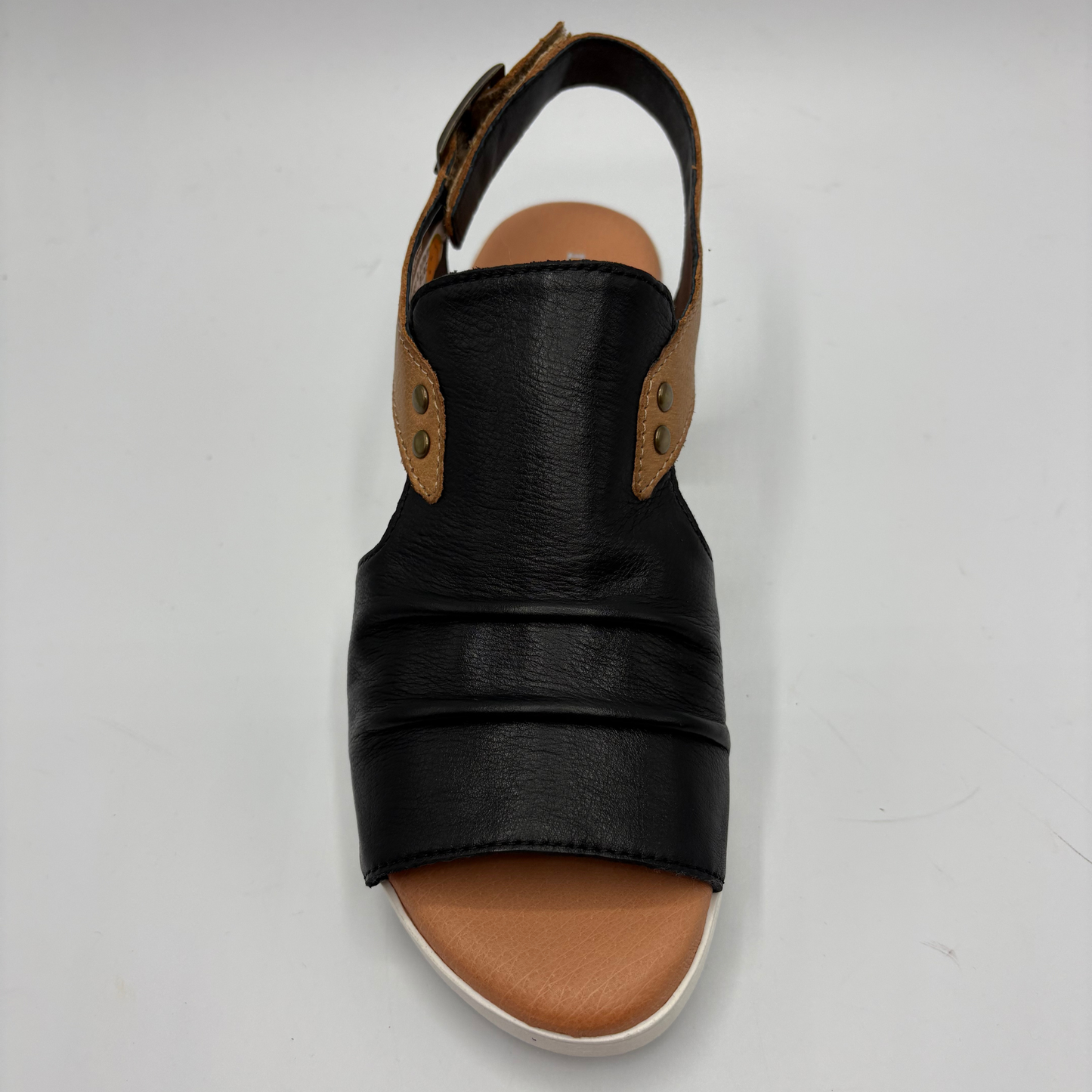 Black sandal with brown sole on a white background