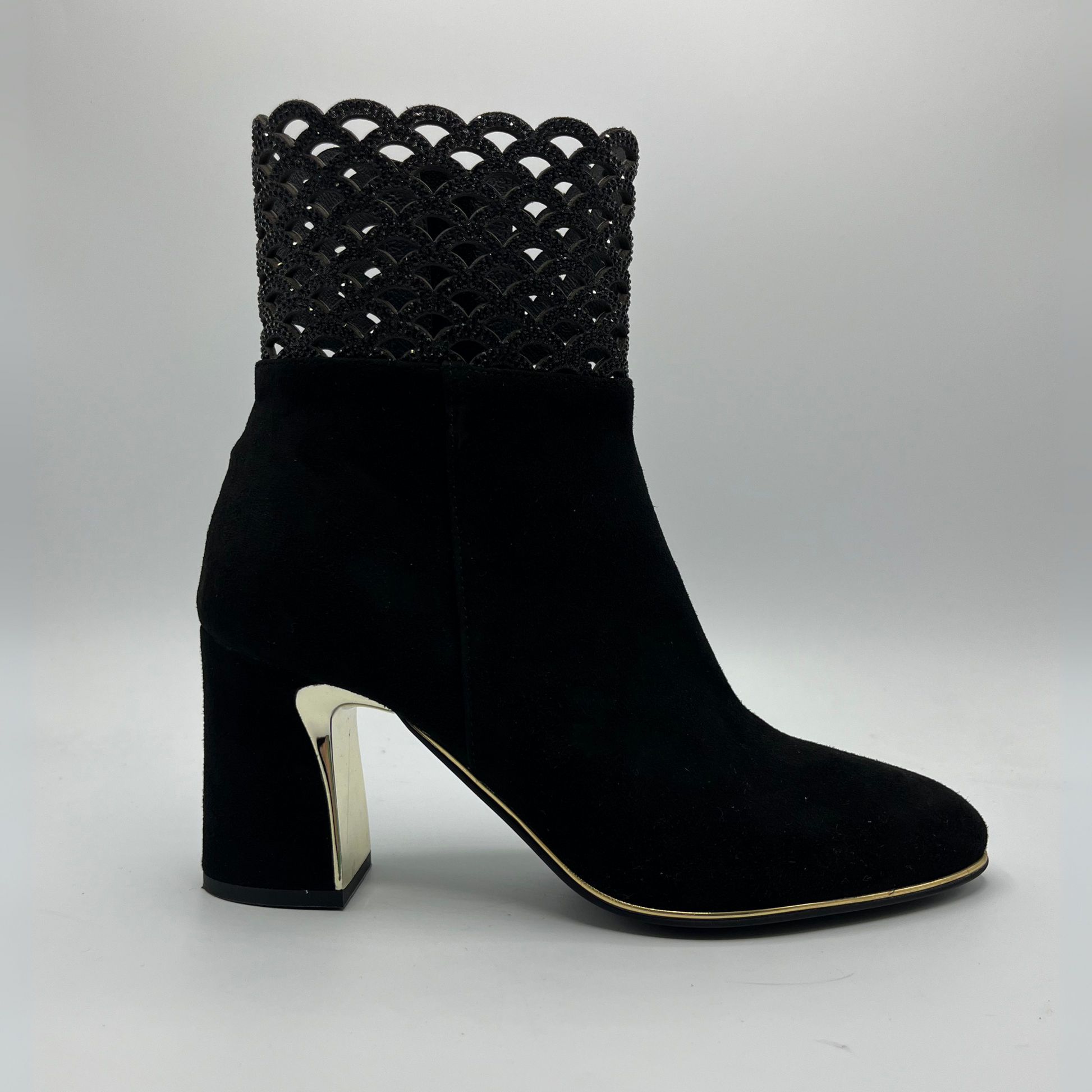 Right facing view of a black high heeled boot with shimmer detail