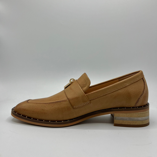 Left facing view of a tan leather loafer
