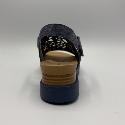 Navy sandal with a brown sole on a white background