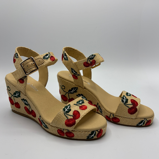 Beige wedge sandals with cherry design on a white background