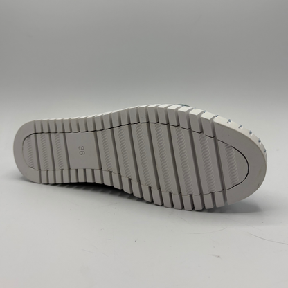 White shoe sole on a light gray background