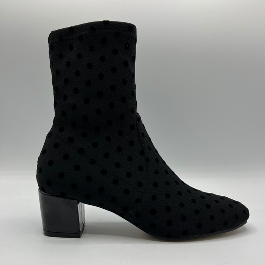 Black polka dot ankle boot on a white background