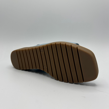 Brown sole of a shoe on a white background