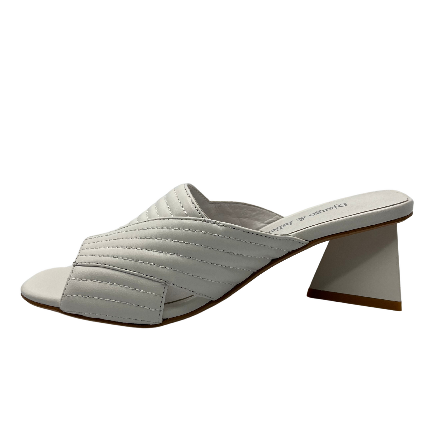 Left facing view of white leather sandal with triangular heel and quilted style upper