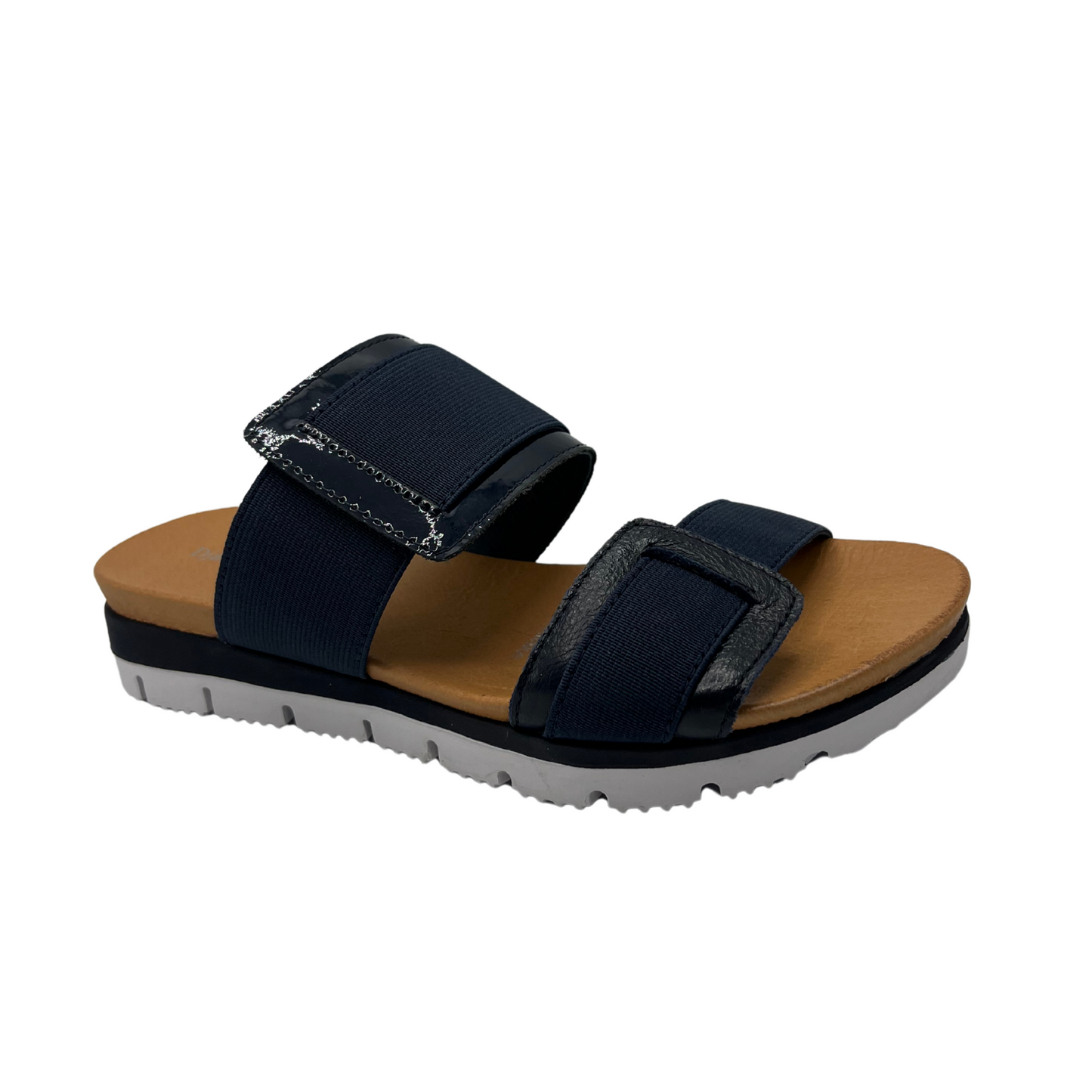 Angled view of navy slip on sandal with a lightweight, flexible outsole.