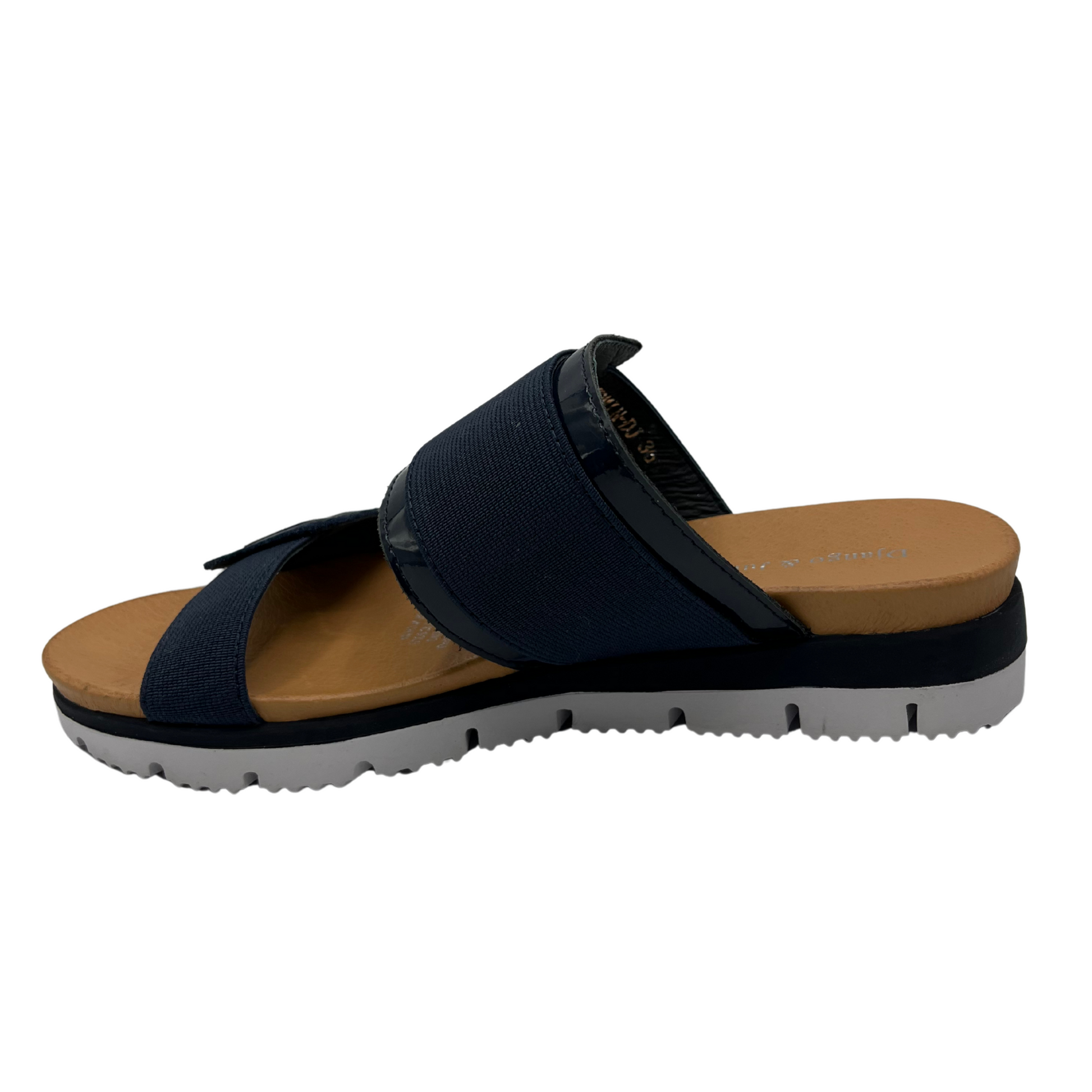 Left facing view of navy slip on sandal with a lightweight, flexible outsole.