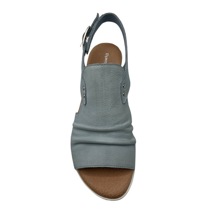 Top view of light blue leather sandal with sling back strap and wedge heel