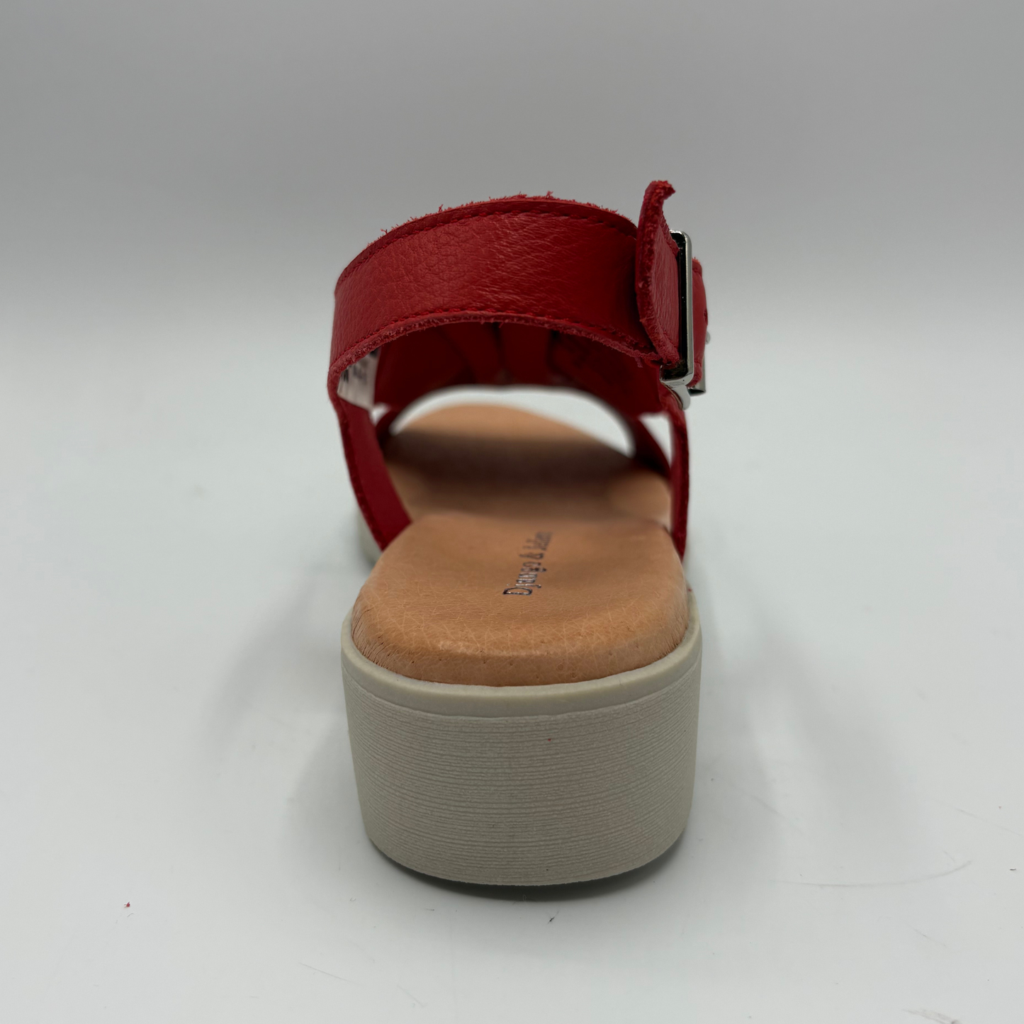 Red sandal with a platform sole on a white background