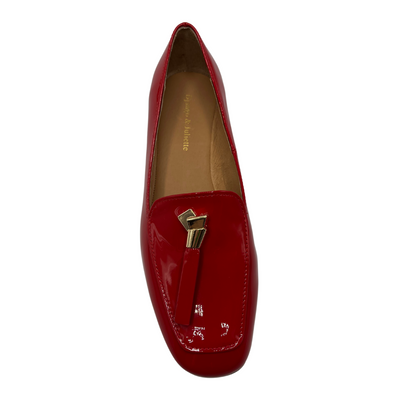 Top view of a red patent leather loafer with a 0.8" heel and a gold and red tassel accent on the toe box.